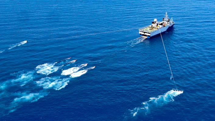 A ship tows research equipment