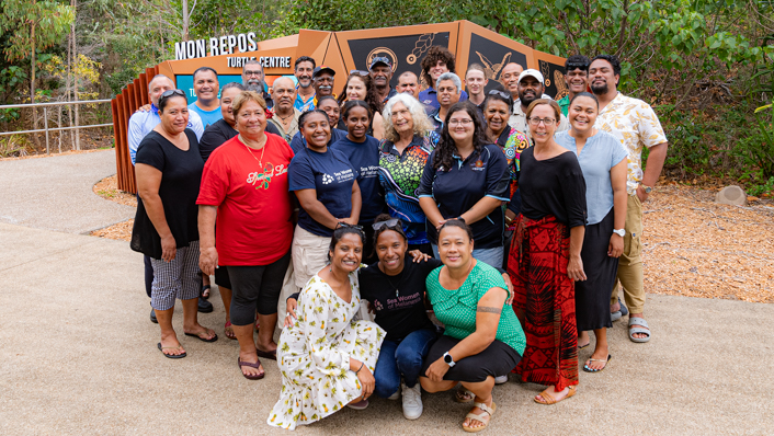 A group stand infront of Mon Repos Turtle centre