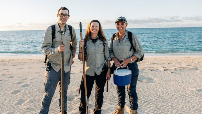 Dr Daniel Gomez Isaza, Dr Michele Thums and Dr Kellie Pendoley collecting turtles on a beach