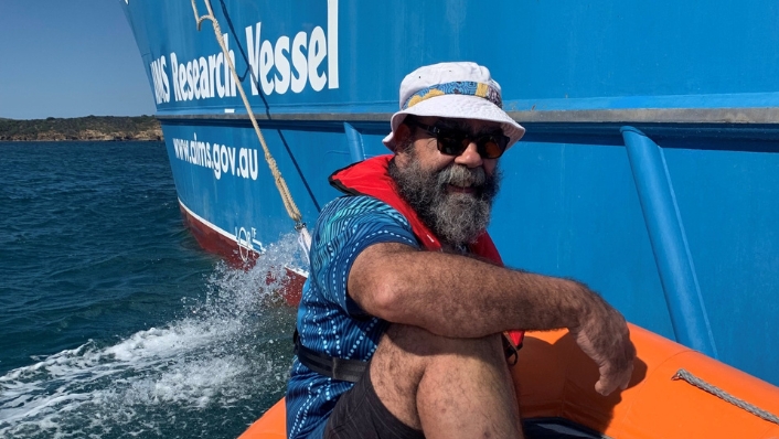 Bob Muir on a tender next to a research vessel