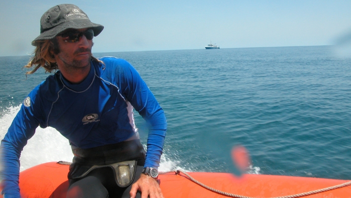 Marine scientist riding on tender