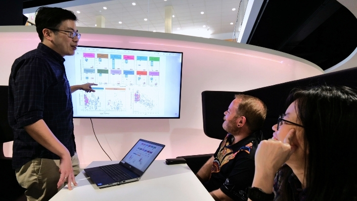 Scientist presenting genomic data visualisations
