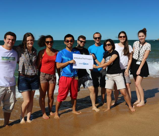 students on AIMS beach celebrating