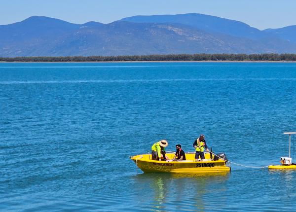 small research vessel tows a surfboard setup with autonomous systems