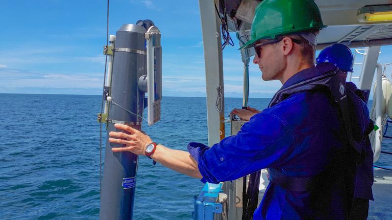Scientist assist instrument on the side of a boat