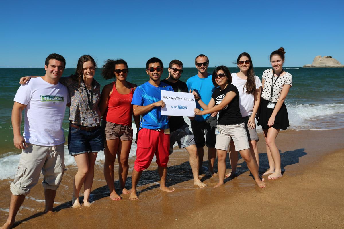 students on AIMS beach celebrating