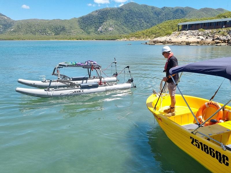 Autonomous surface vessel on water with Mt Cleveland behind
