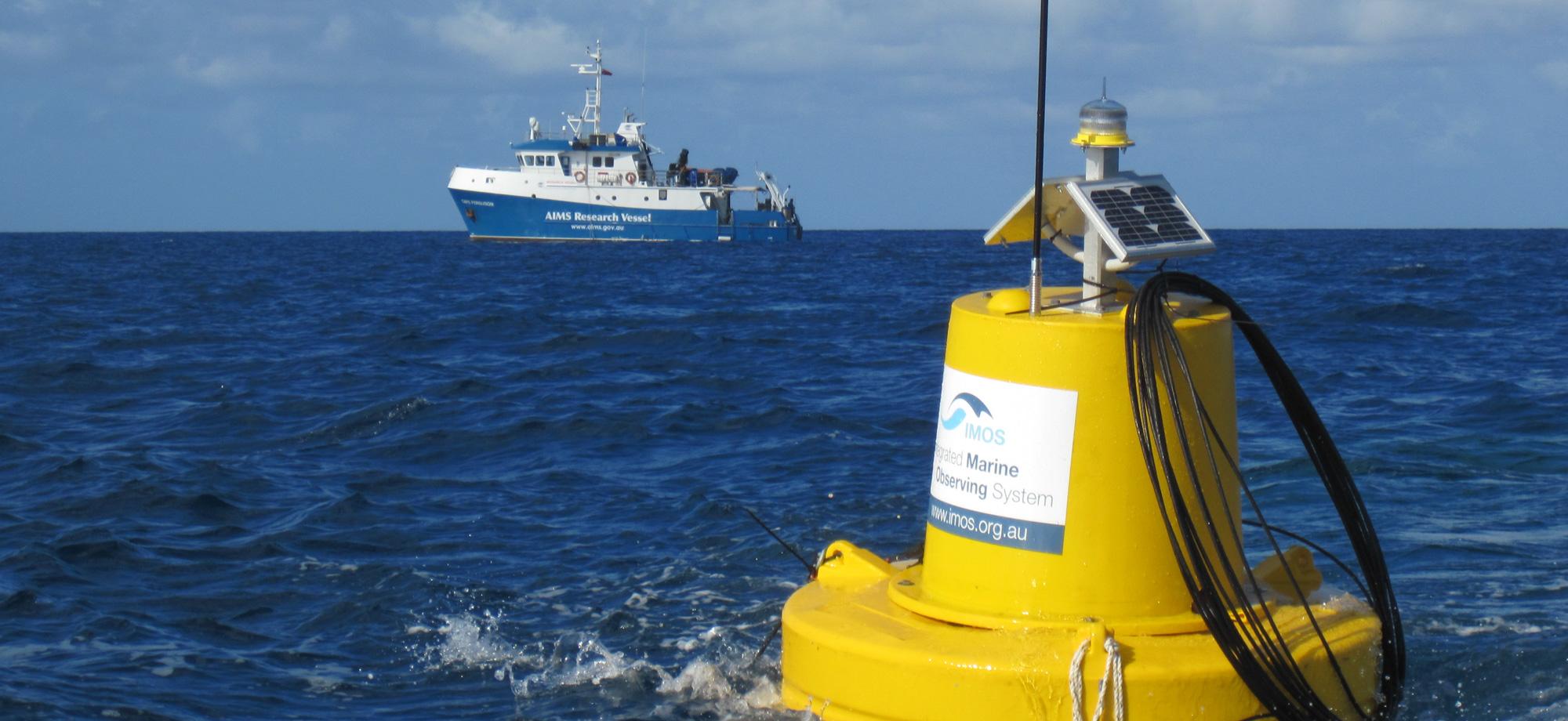 yellow buoy with AIMS research vessel in background