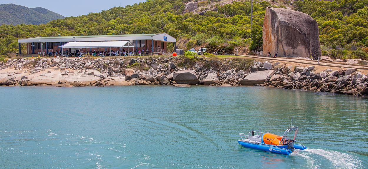Autonomous vessel turns towards marine operations, a building on the foreshore at the Australian Institute of Marine Science