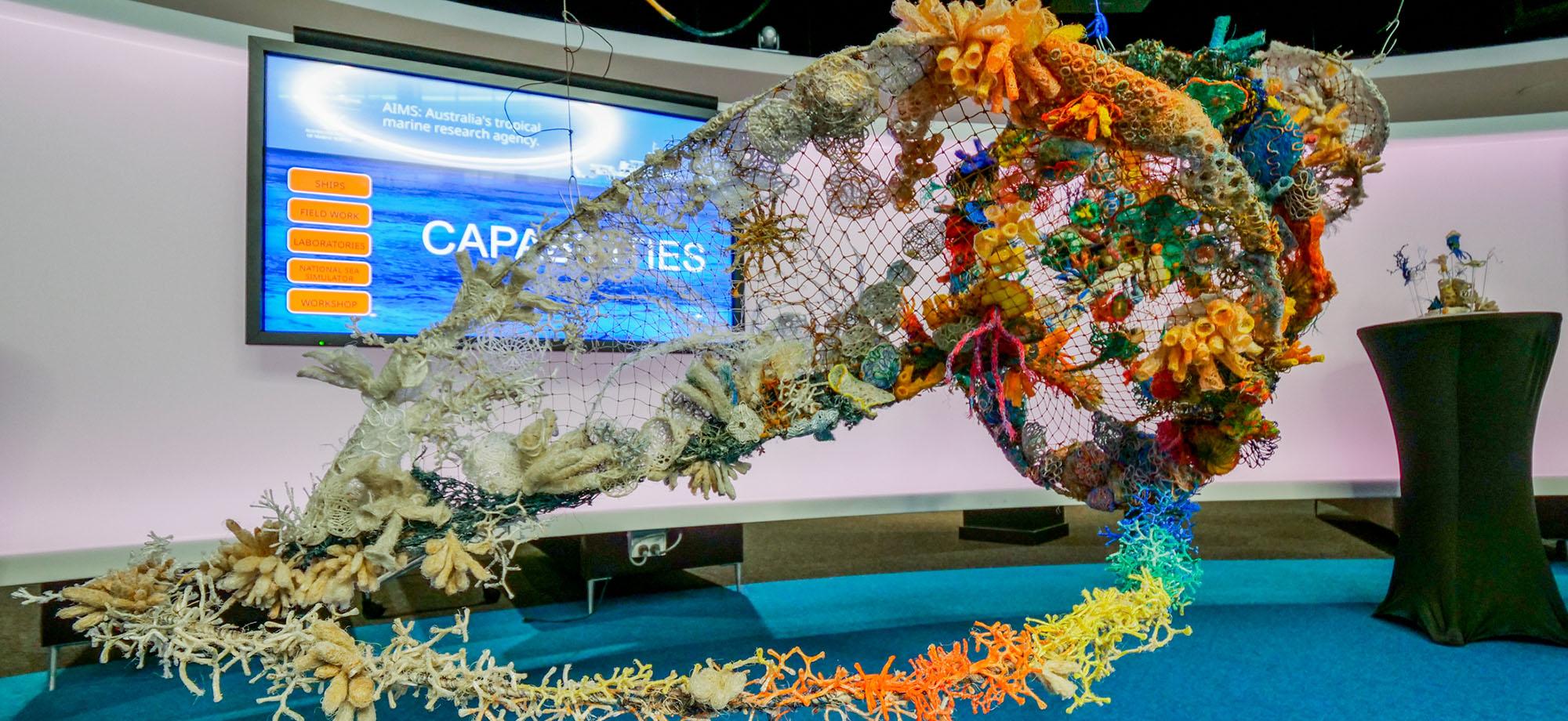 Triton shell art installation made by ghost nets
