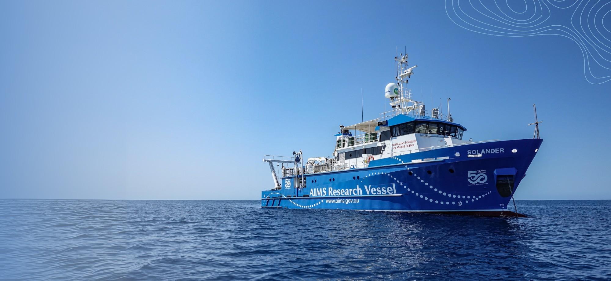 a large research vessel on the ocean on a calm day