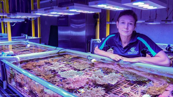 Madeleine van Oppen next to coral tank
