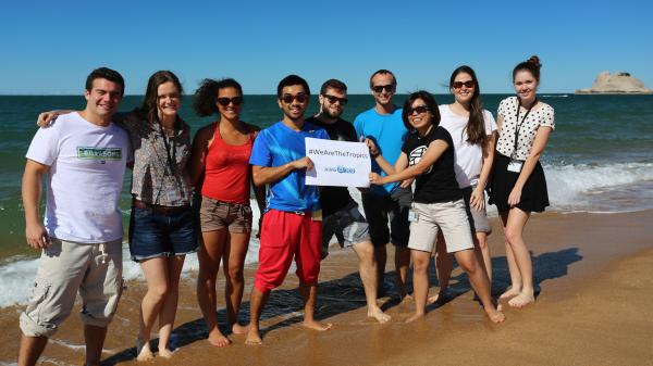 students on AIMS beach celebrating