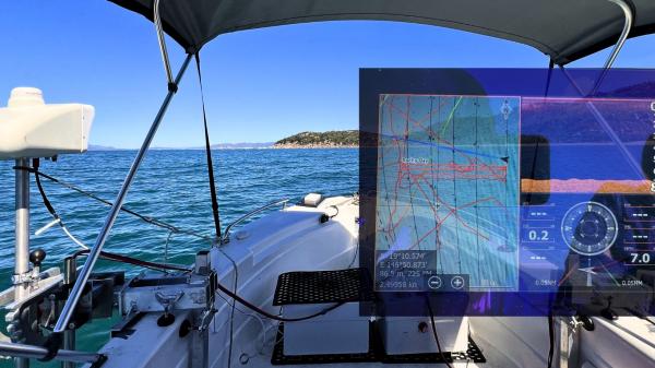 Composite image of the robotics hardware on a boat, overlaid with on-screen data outputs