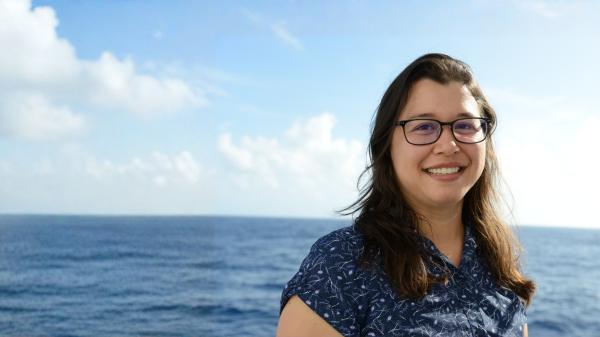Oceanographer Dr Jessica Benthuysen with an ocean background