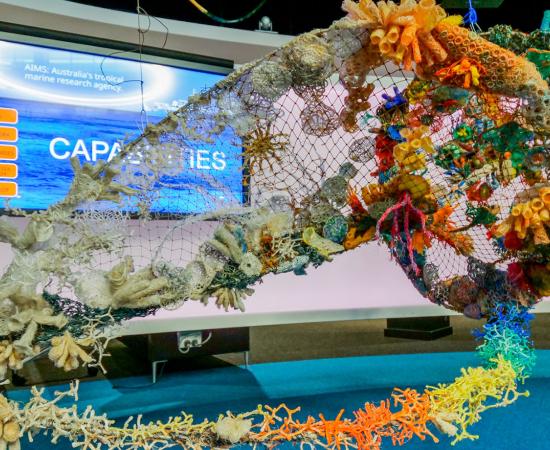 Triton shell art installation made by ghost nets