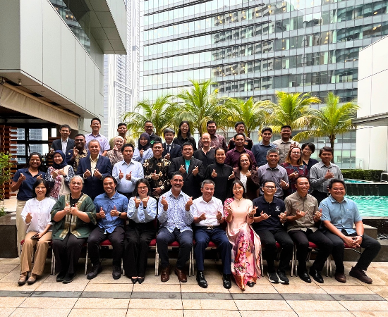 Large group of delegates pose for a formal photo in Kuala Lumpur, Malaysia