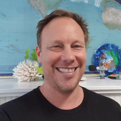 Photo of James wearing a black shirt.