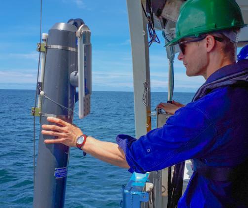 Scientist assist instrument on the side of a boat