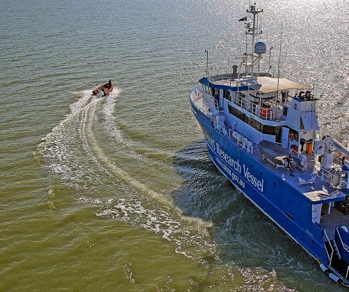 research vessel in water which appears muddy